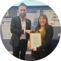 Gary Waltham presenting Merit Award to Heather McNaught