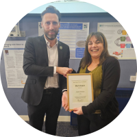 Gary Waltham presenting Merit Award to Heather McNaught