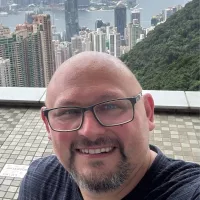 A photo of Christopher Edge smiling at the camera