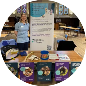 Georgia Ogilvie stands at her jobs fair stall, smiling