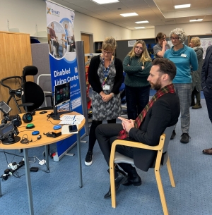Sarah Sutton at the Disabled Living Centre showing Gary their tech
