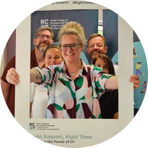 Lauren Walker posing with Welsh OTs after presenting housing document in Wales