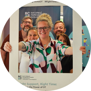 Lauren Walker posing with Welsh OTs after presenting housing document in Wales