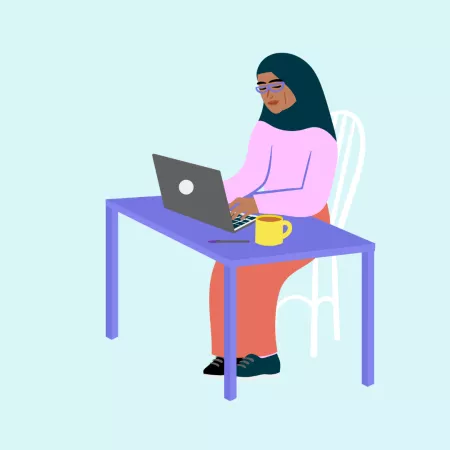 Women sat down on laptop