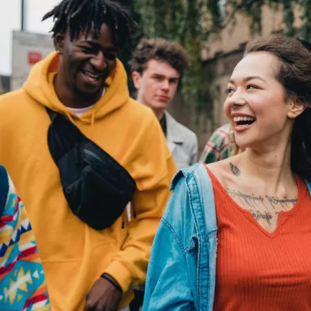group of people walking and smiling