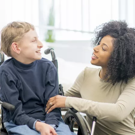 occupational therapist and young boy