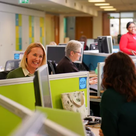 Workforce planning - happy people communicating in an office 