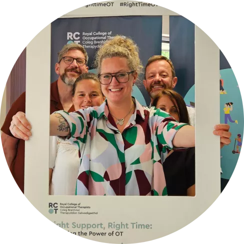 Lauren Walker posing with Welsh OTs after presenting housing document in Wales